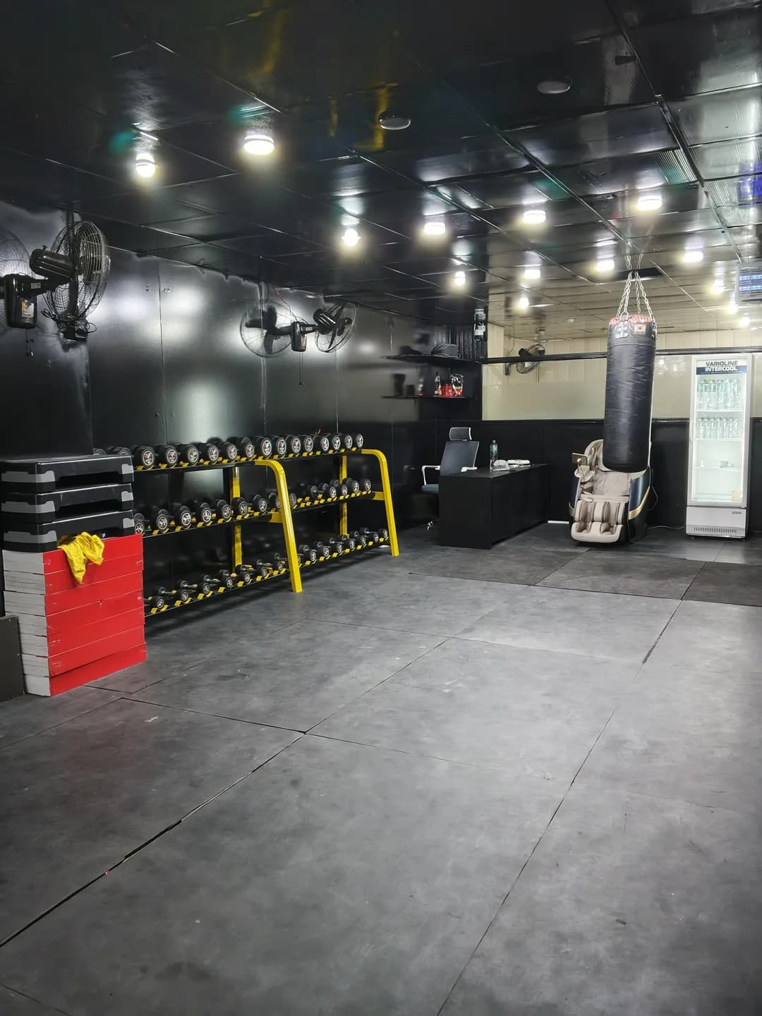 Free weights and open movement space inside SyK Fitness Studio